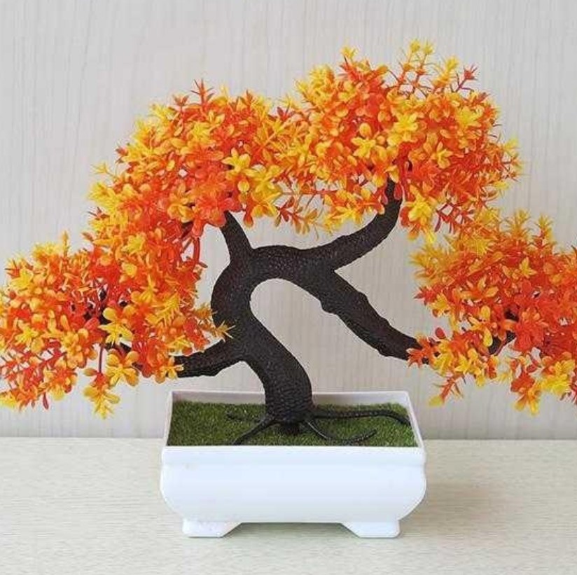 Plastic bonsai with fake flowers